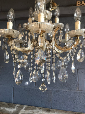 A large and ornate dressed chandelier