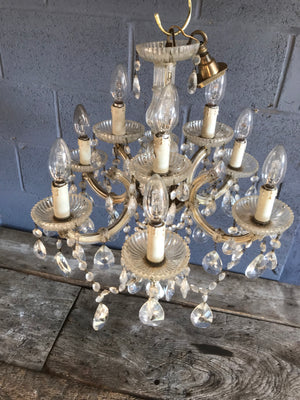 A large and ornate dressed chandelier