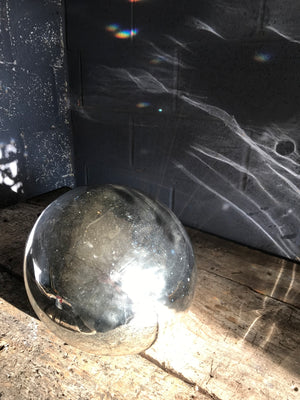 A very large silver mercury glass witches ball