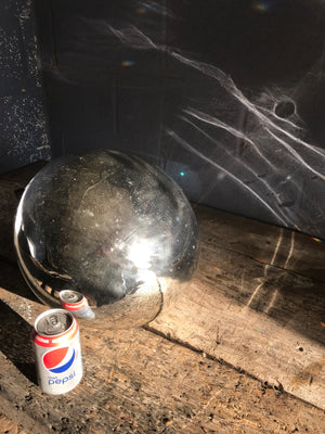 A very large silver mercury glass witches ball