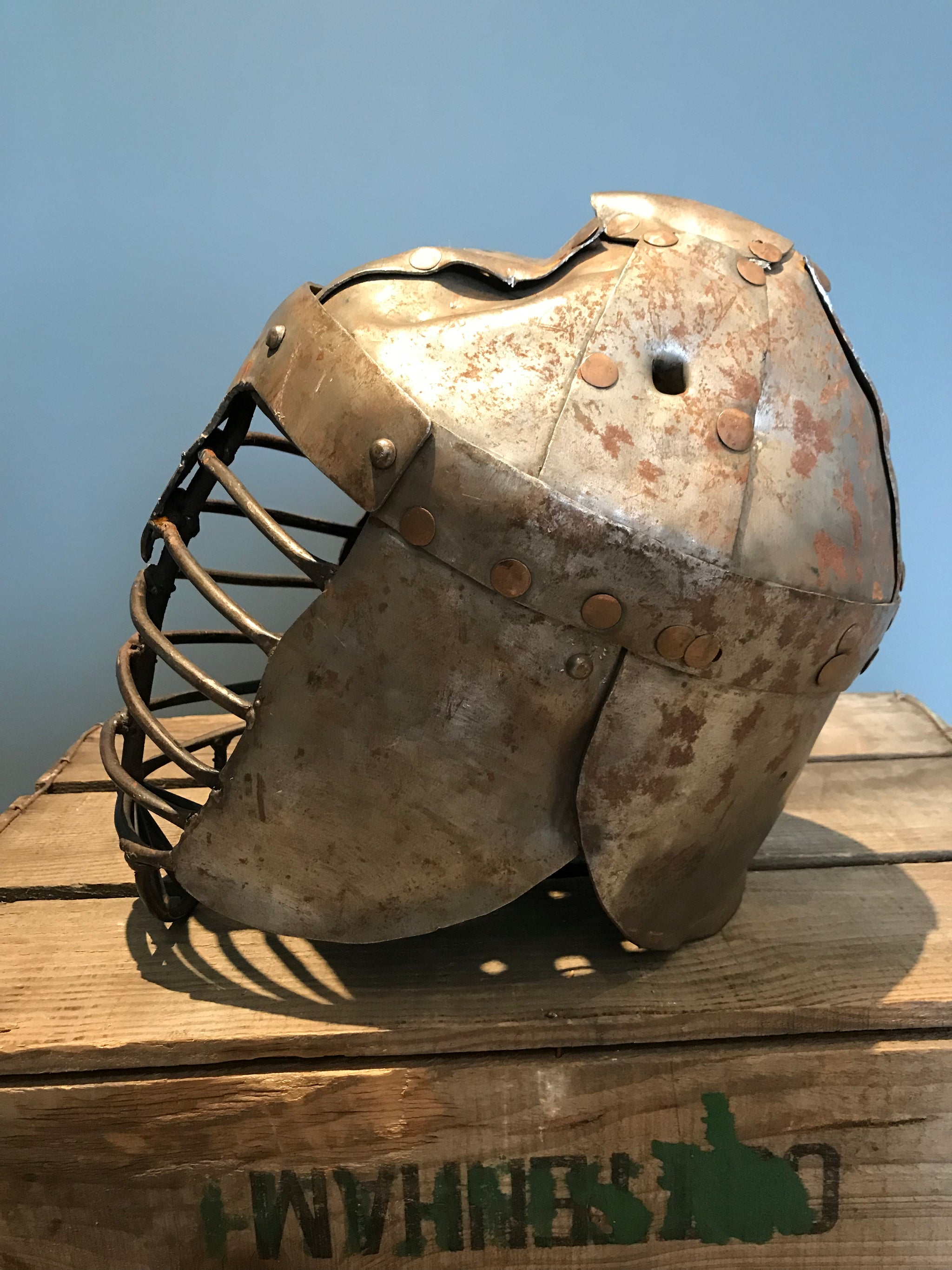 A metal re-enactment armour helmet for a warrior or knight