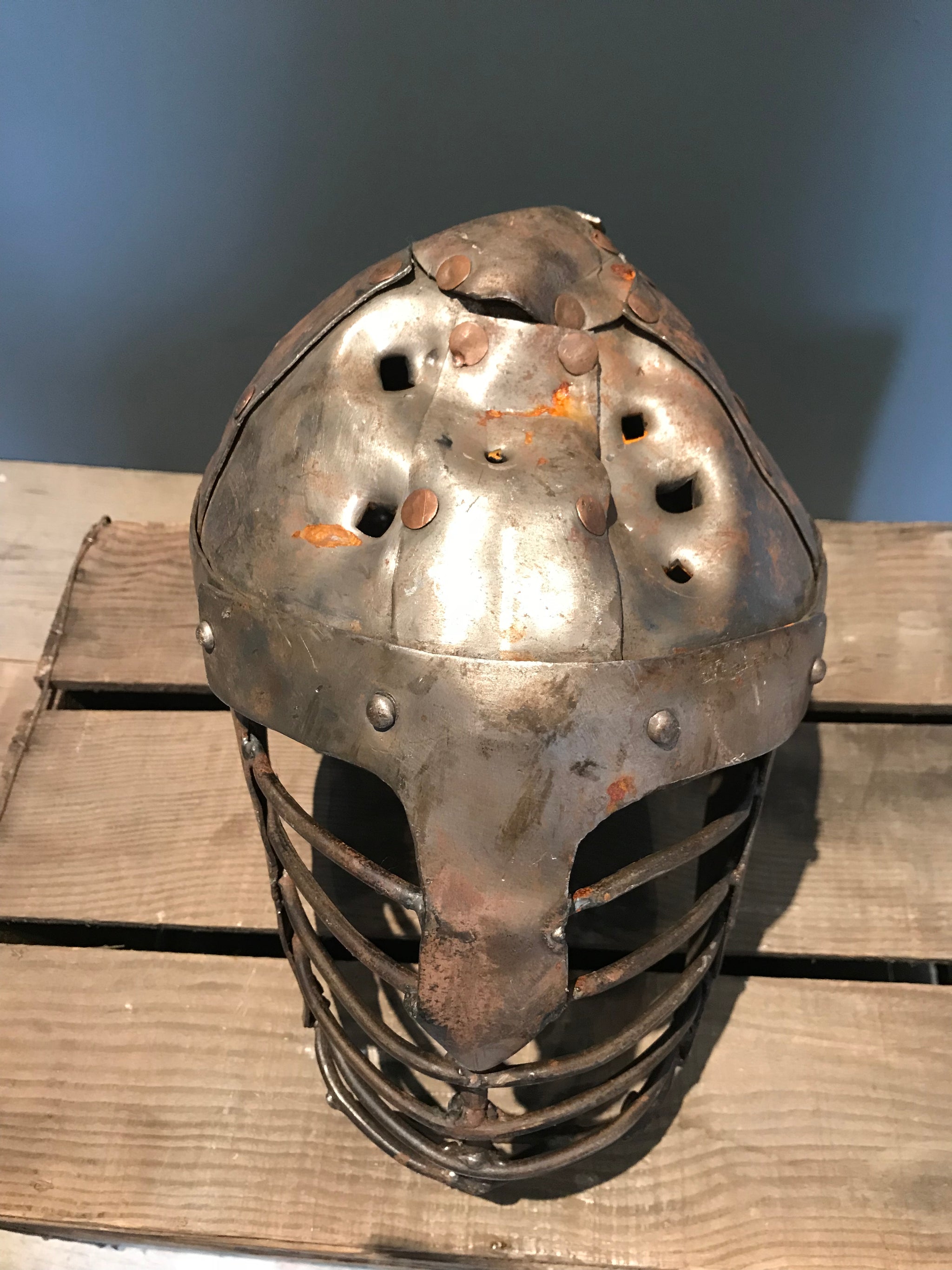 A metal re-enactment armour helmet for a warrior or knight