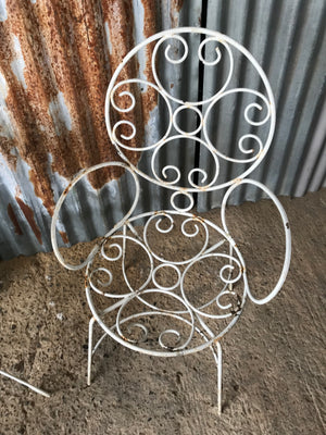 An elegant French white metal chair and table