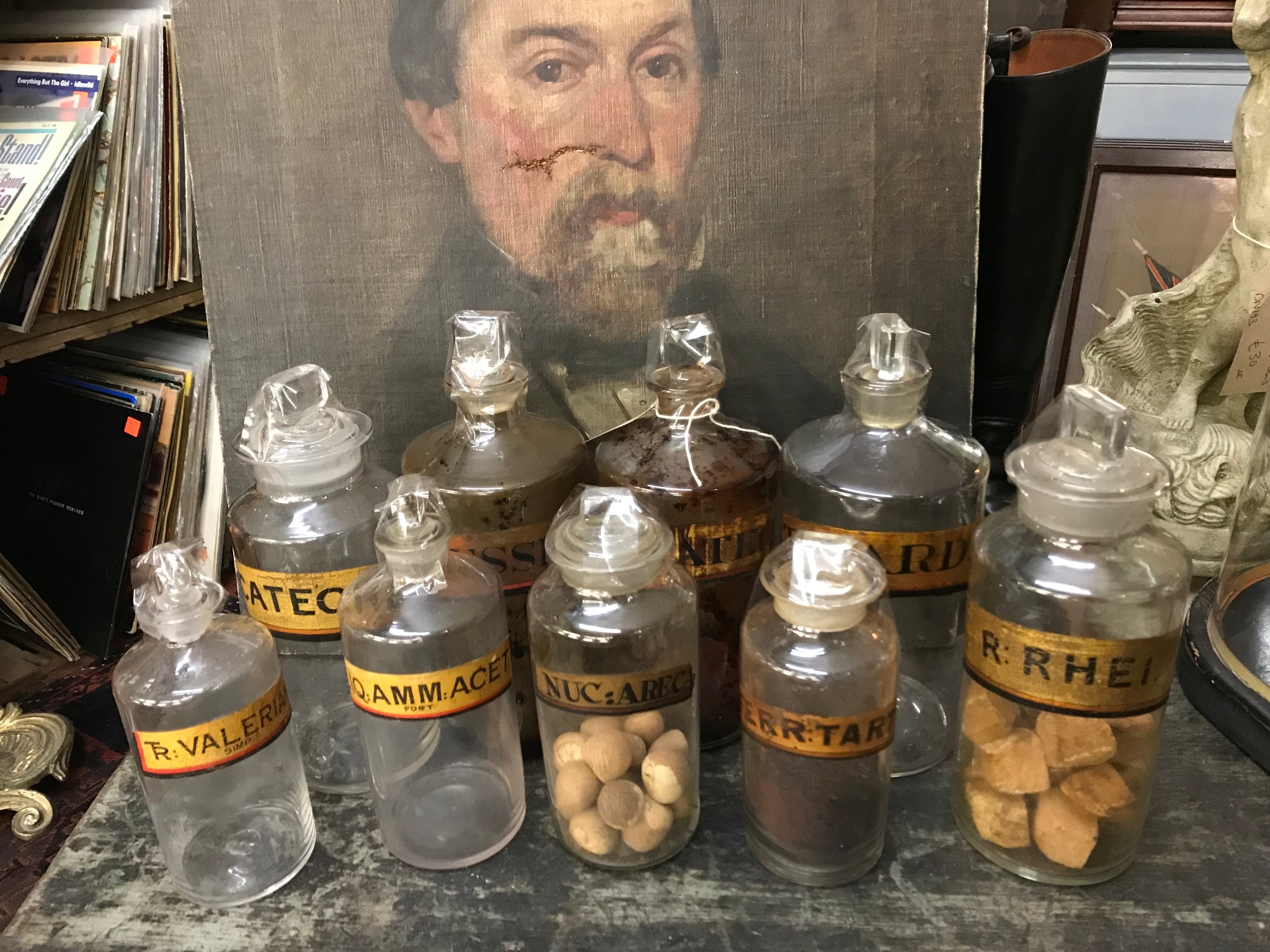 A collection of nine gilt label glass apothecary bottles