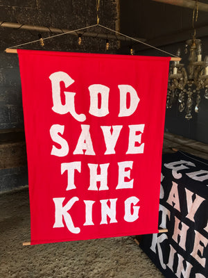 A red WWI centenary coronation banner: "God Save The King"