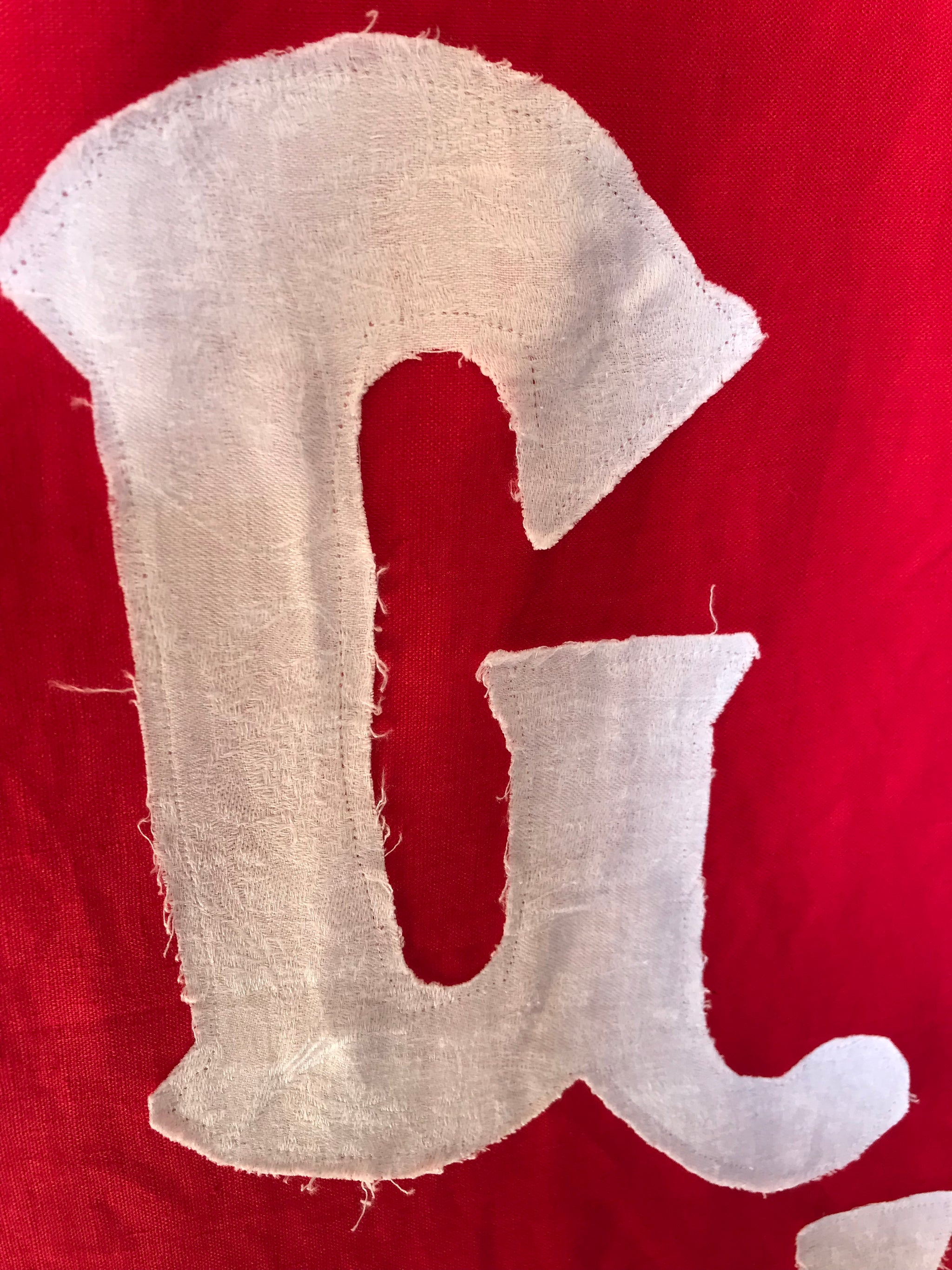 A red WWI centenary coronation banner: "God Save The King"