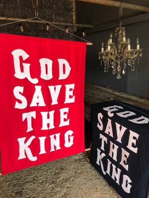 A red WWI centenary coronation banner: "God Save The King"