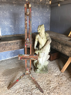 An oak floor standing studio artist's easel