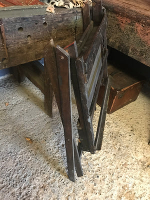 An unusual and rare wooden floor standing rack easel