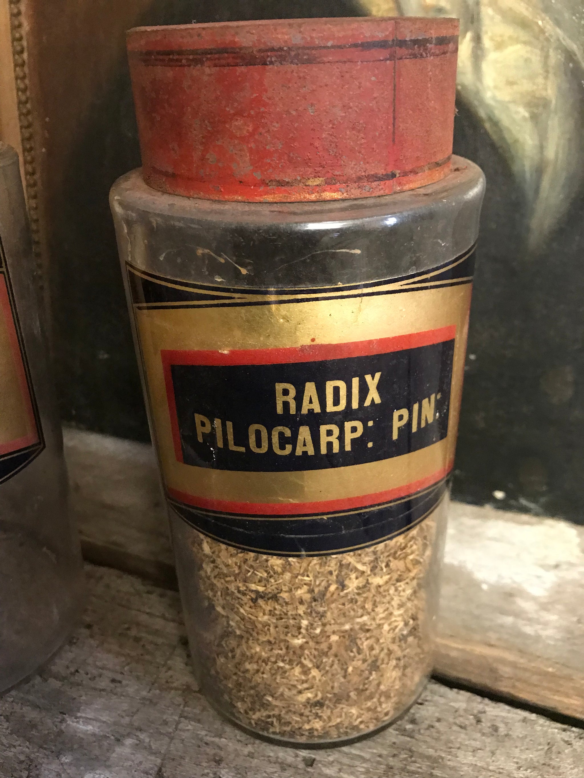 A collection of six gilt label large glass apothecary jars