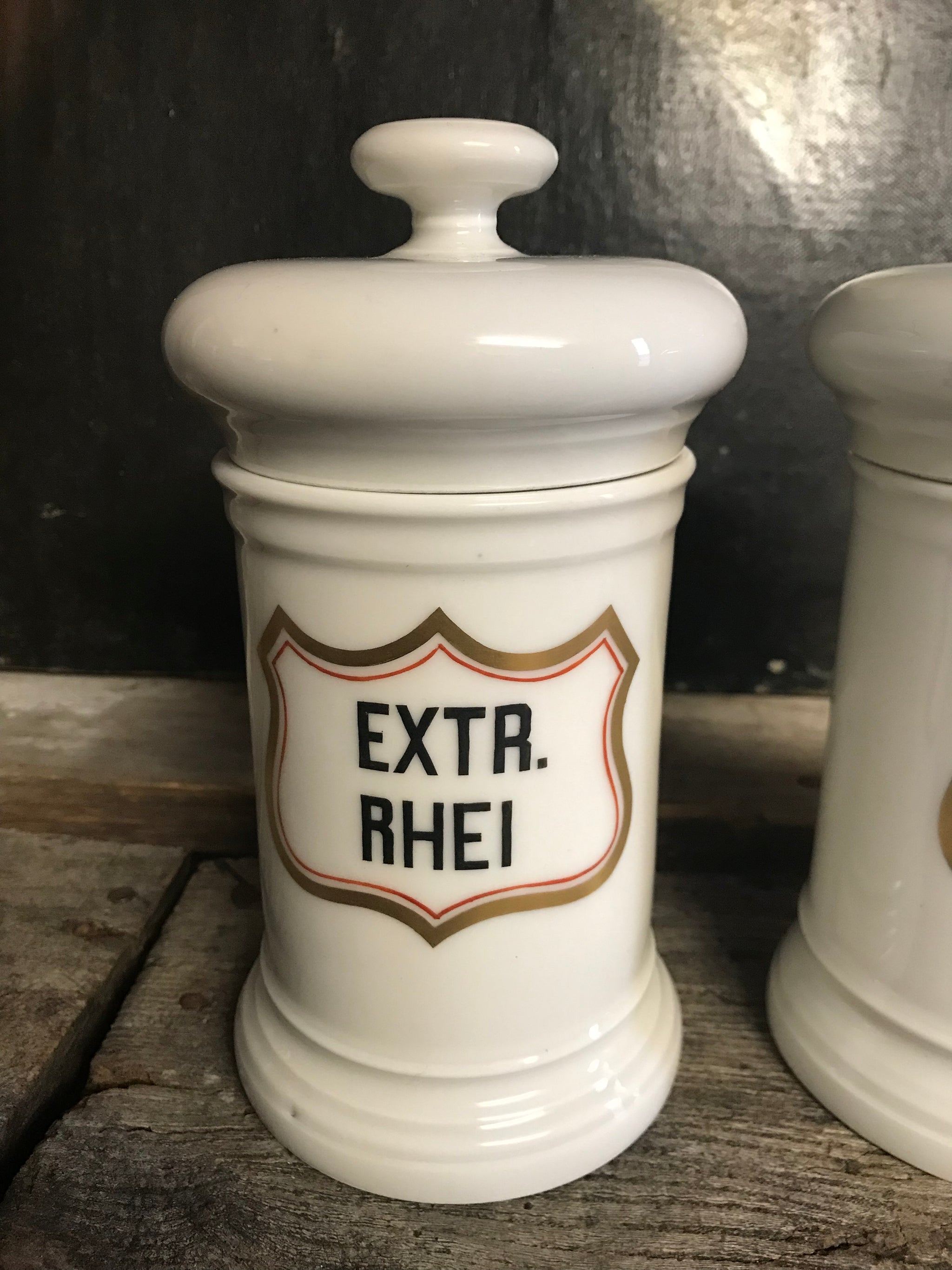 A pair of large white porcelain apothecary jars with lids