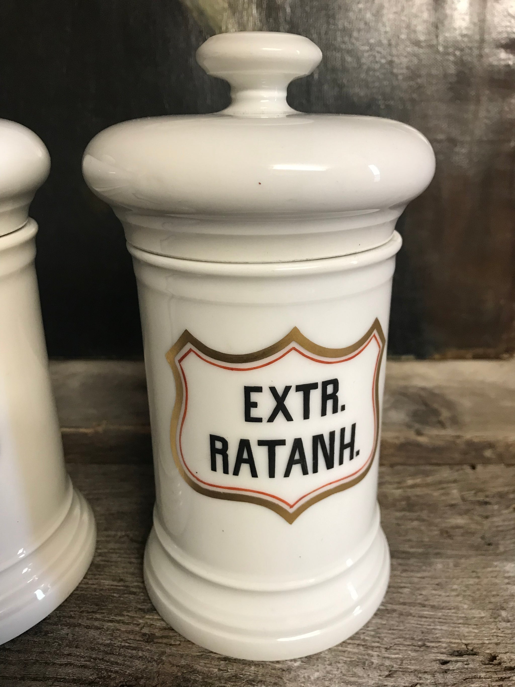 A pair of large white porcelain apothecary jars with lids