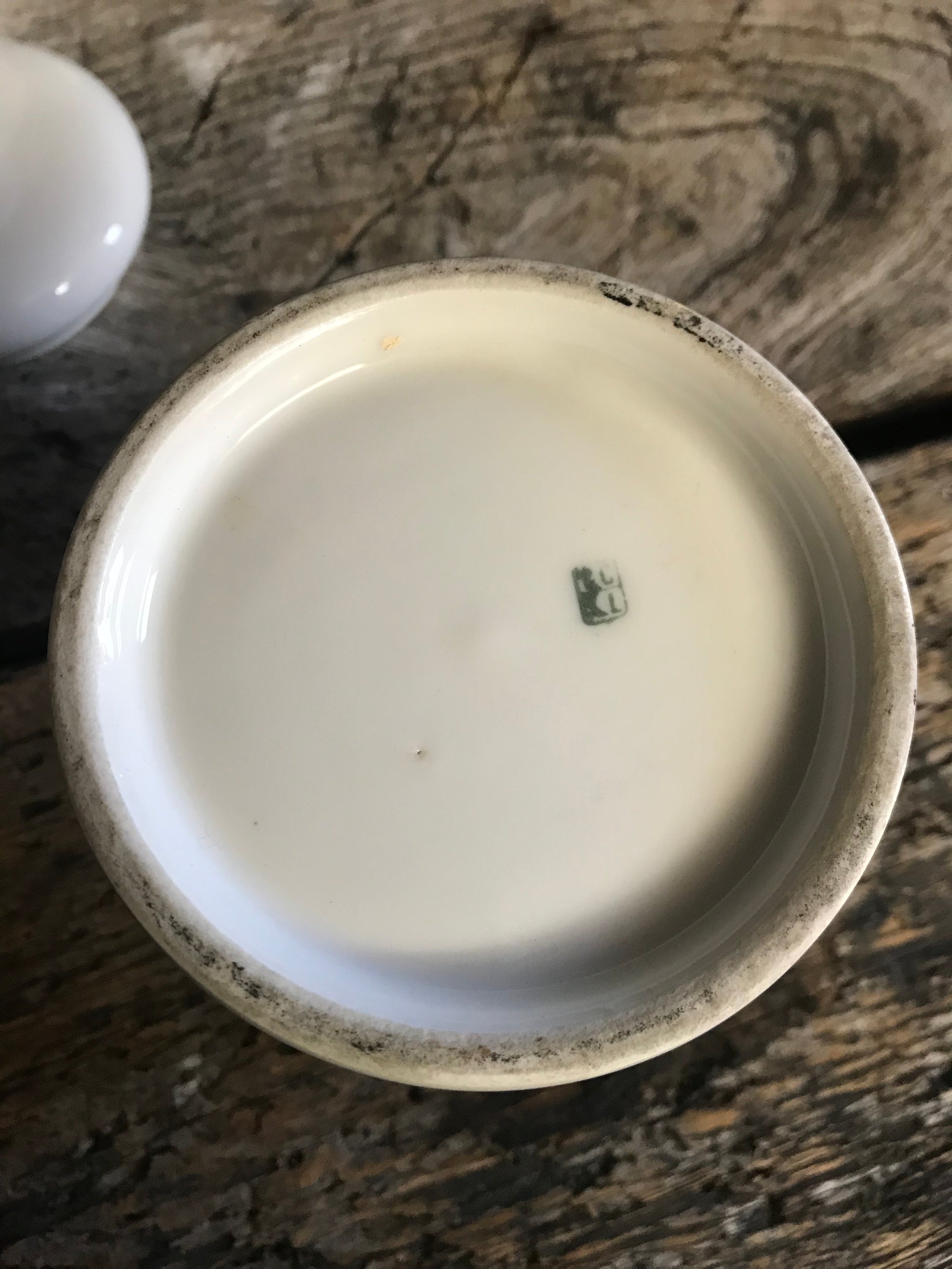 A pair of large white porcelain apothecary jars with lids