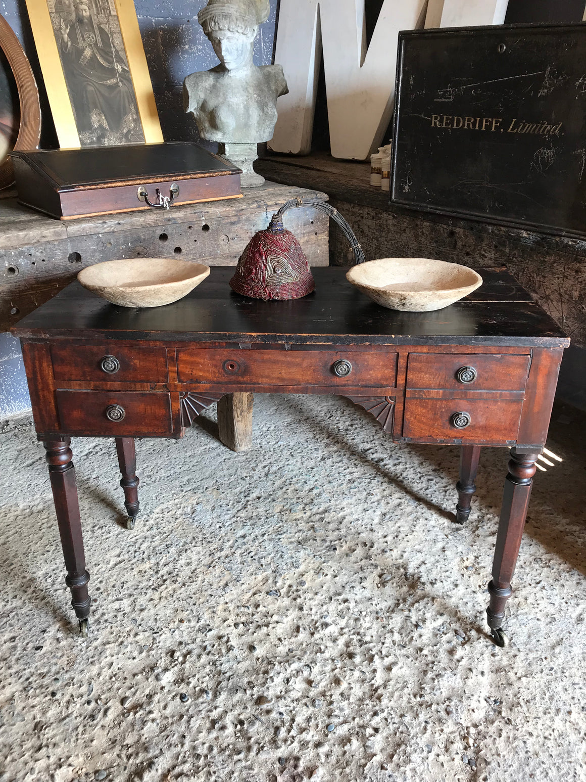 A 19th Century Georgian console table with brass castors