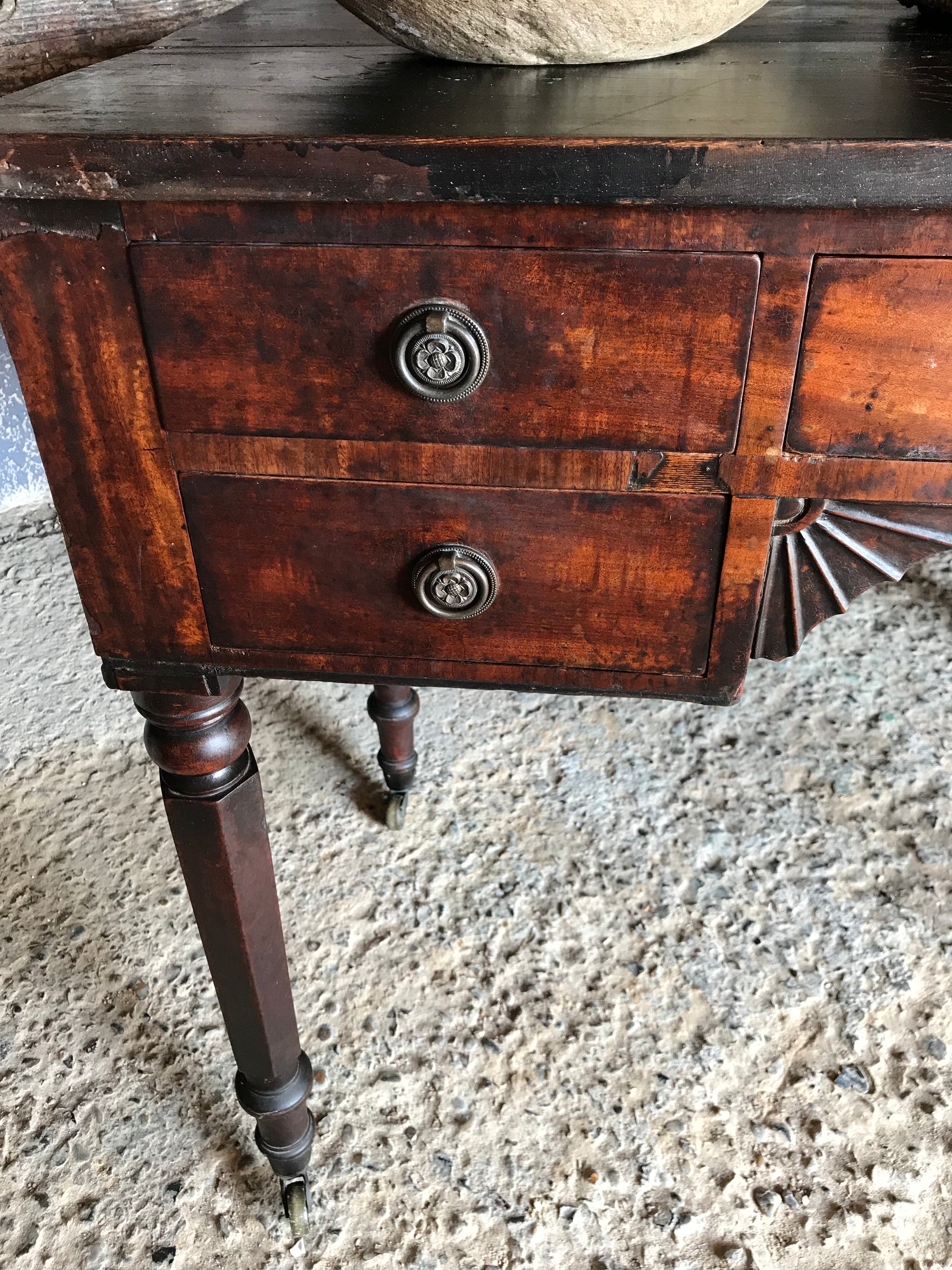 A 19th Century Georgian console table with brass castors