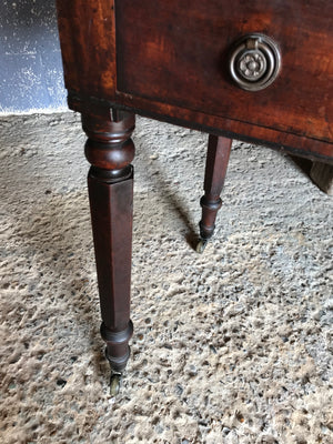 A 19th Century Georgian console table with brass castors