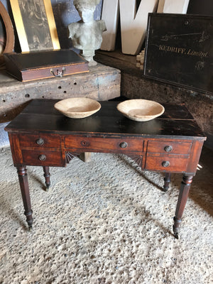 A pair of handmade rough hewn marble bowls