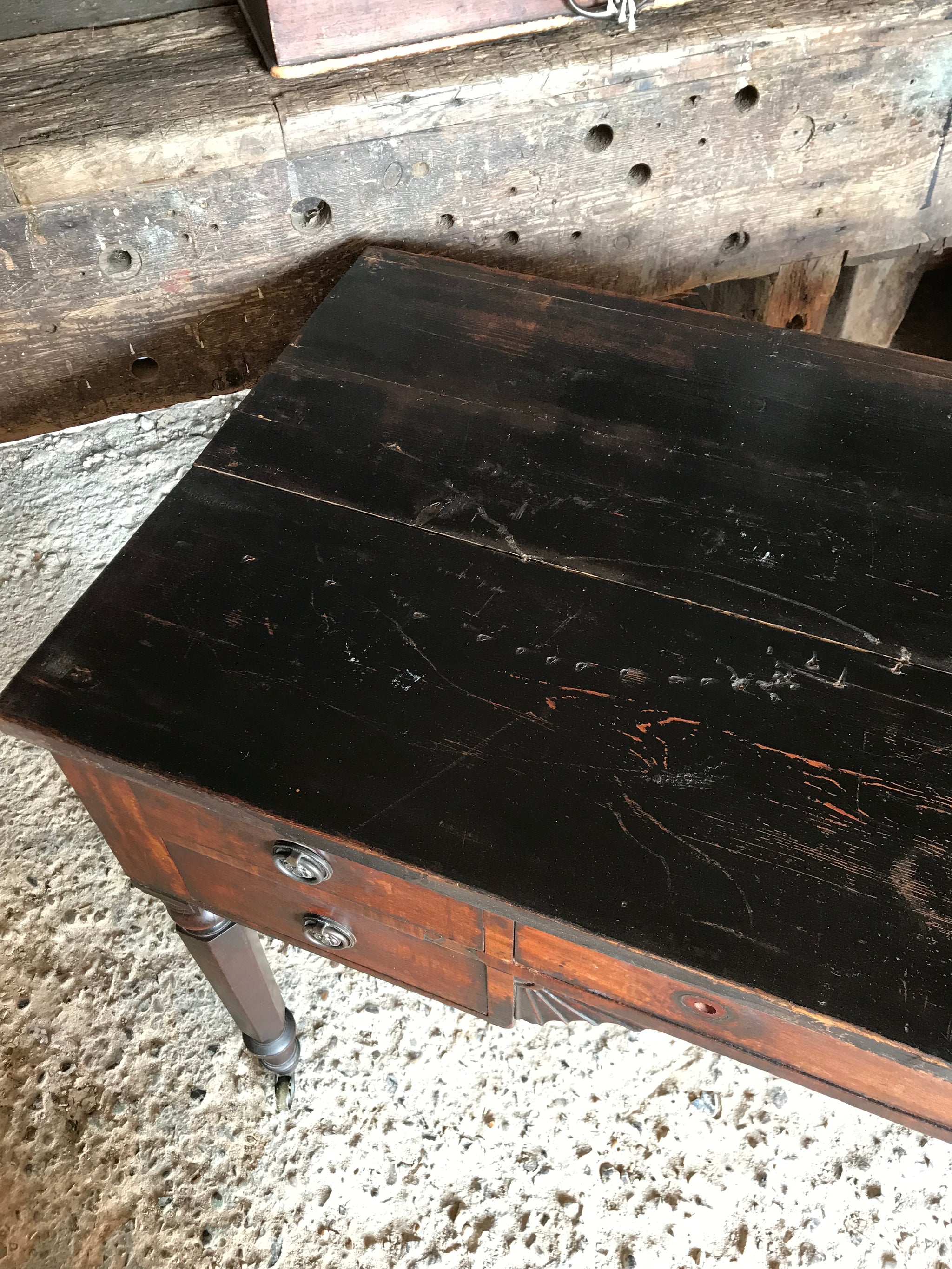 A 19th Century Georgian console table with brass castors