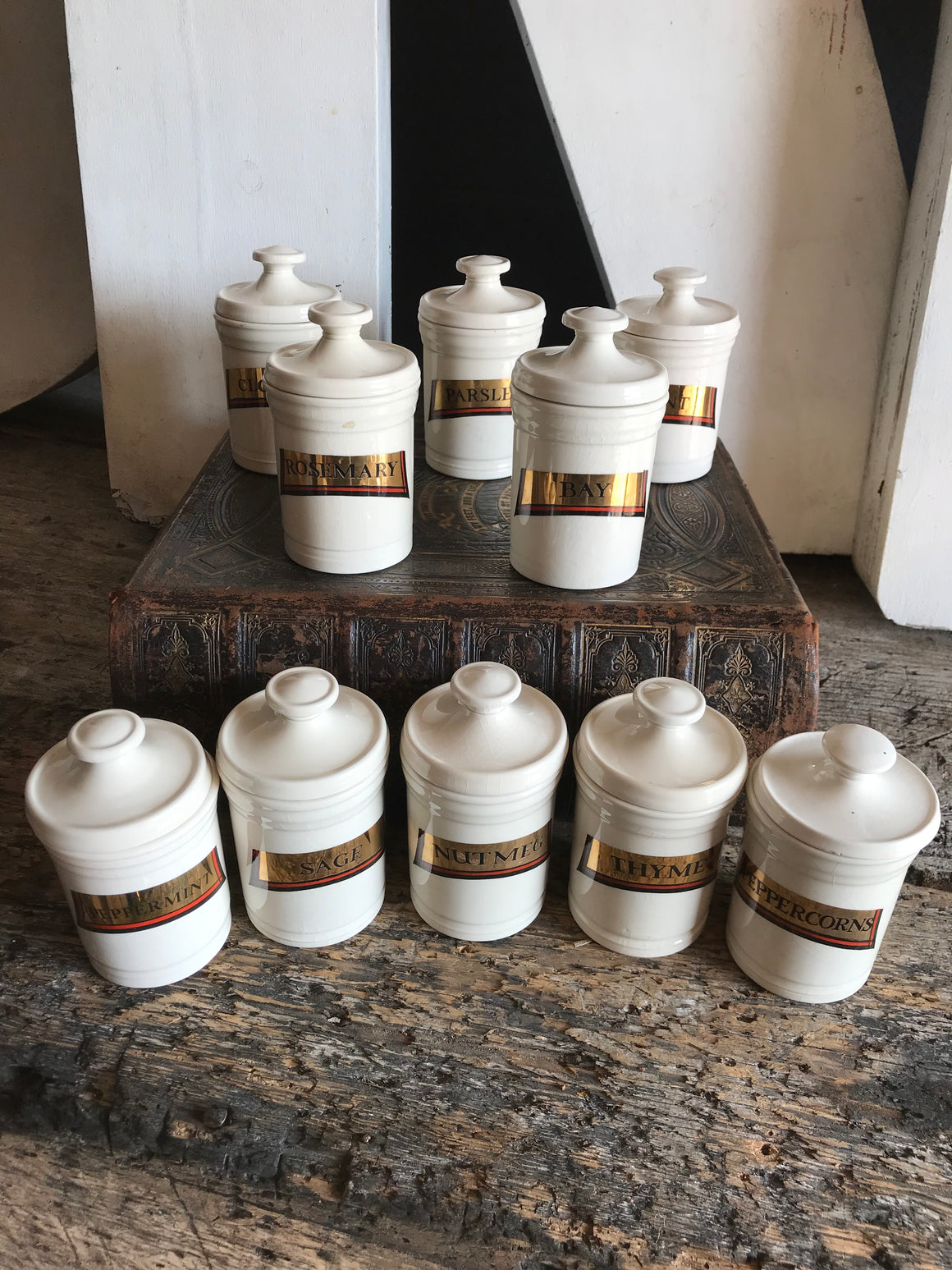 A collection of porcelain apothecary spice jars