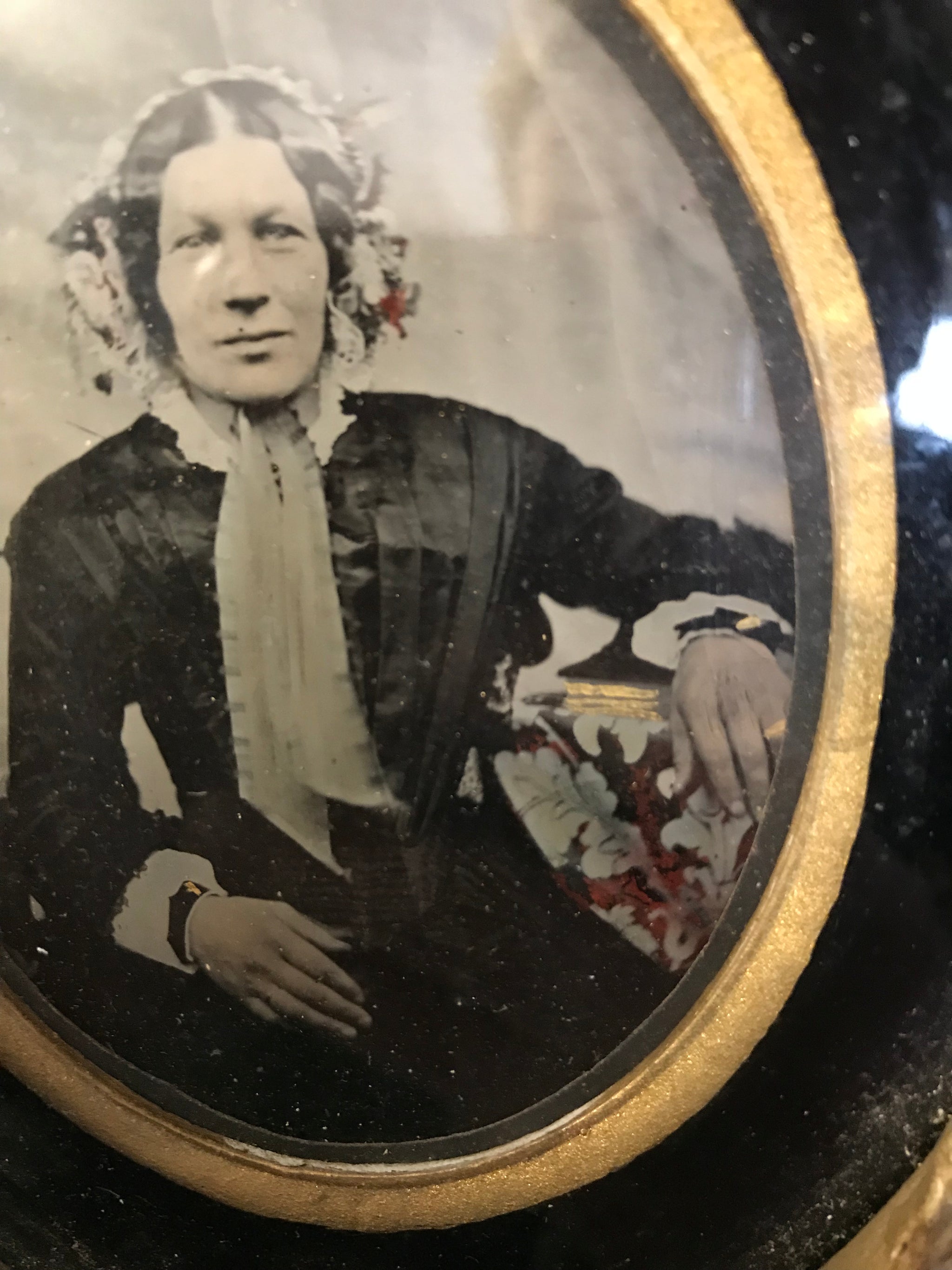 A hand tinted portrait Daguerreotype photograph in an oval gilt frame- large