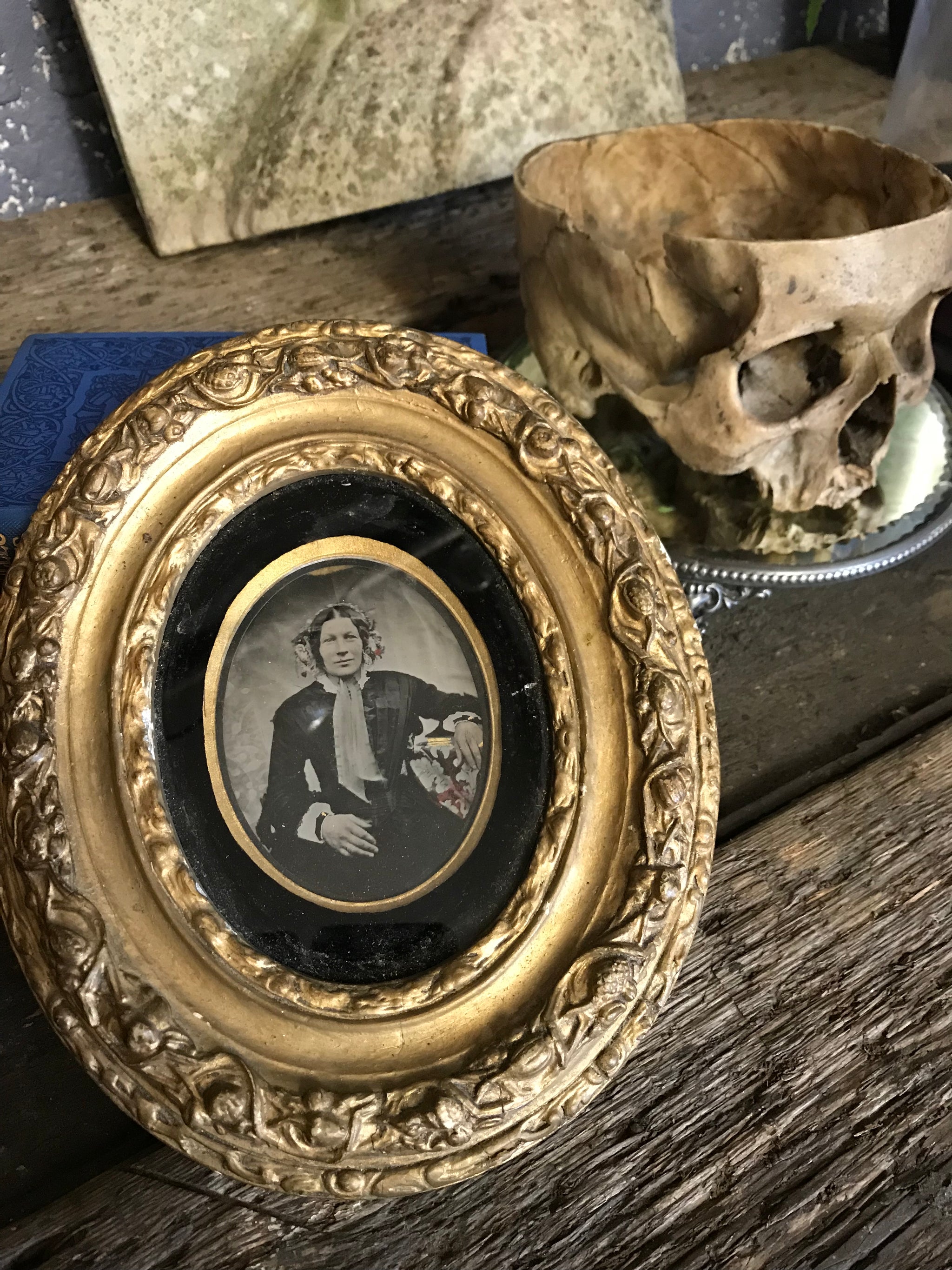 A hand tinted portrait Daguerreotype photograph in an oval gilt frame- large