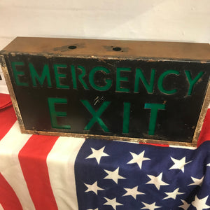 A metal emergency exit light box sign