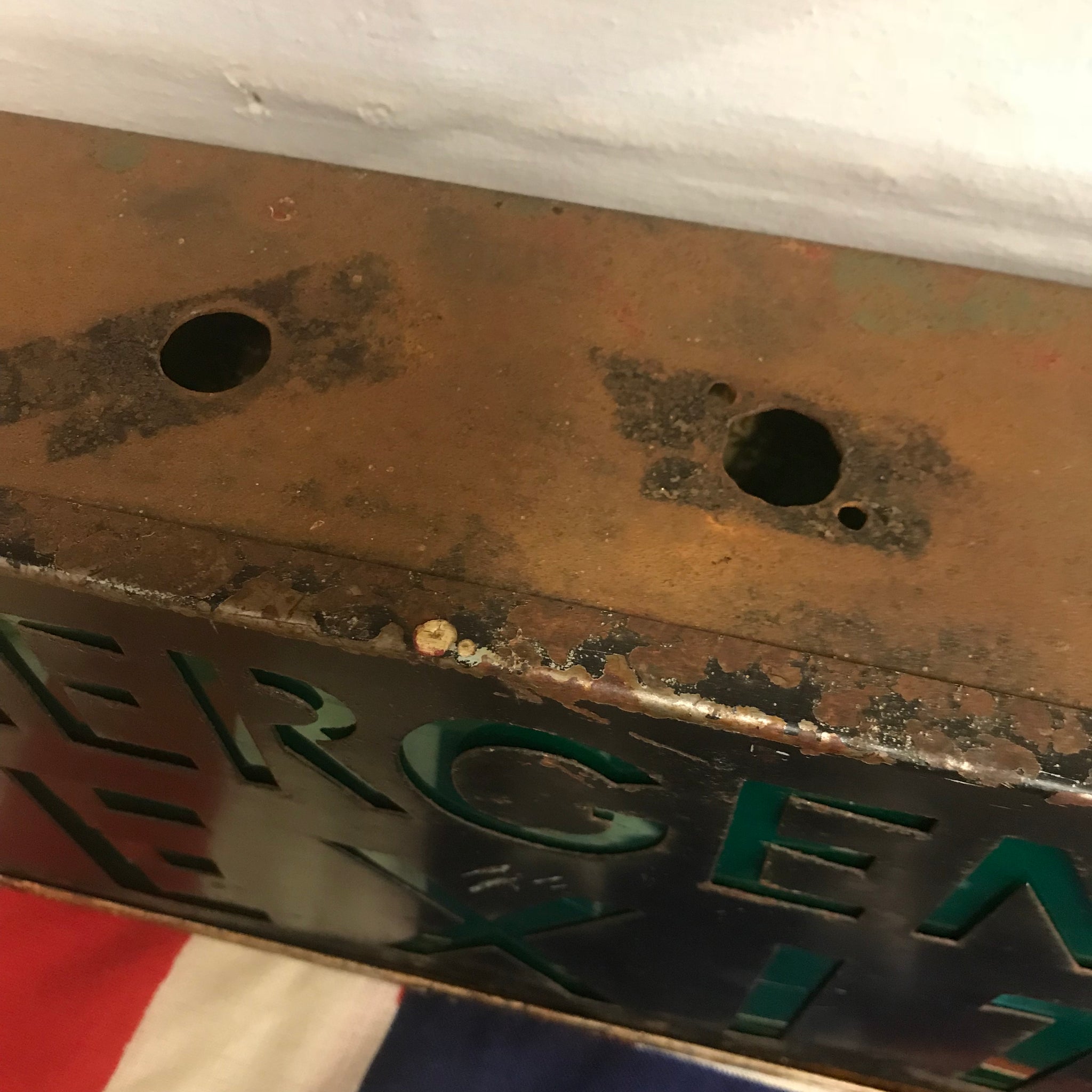 A metal emergency exit light box sign