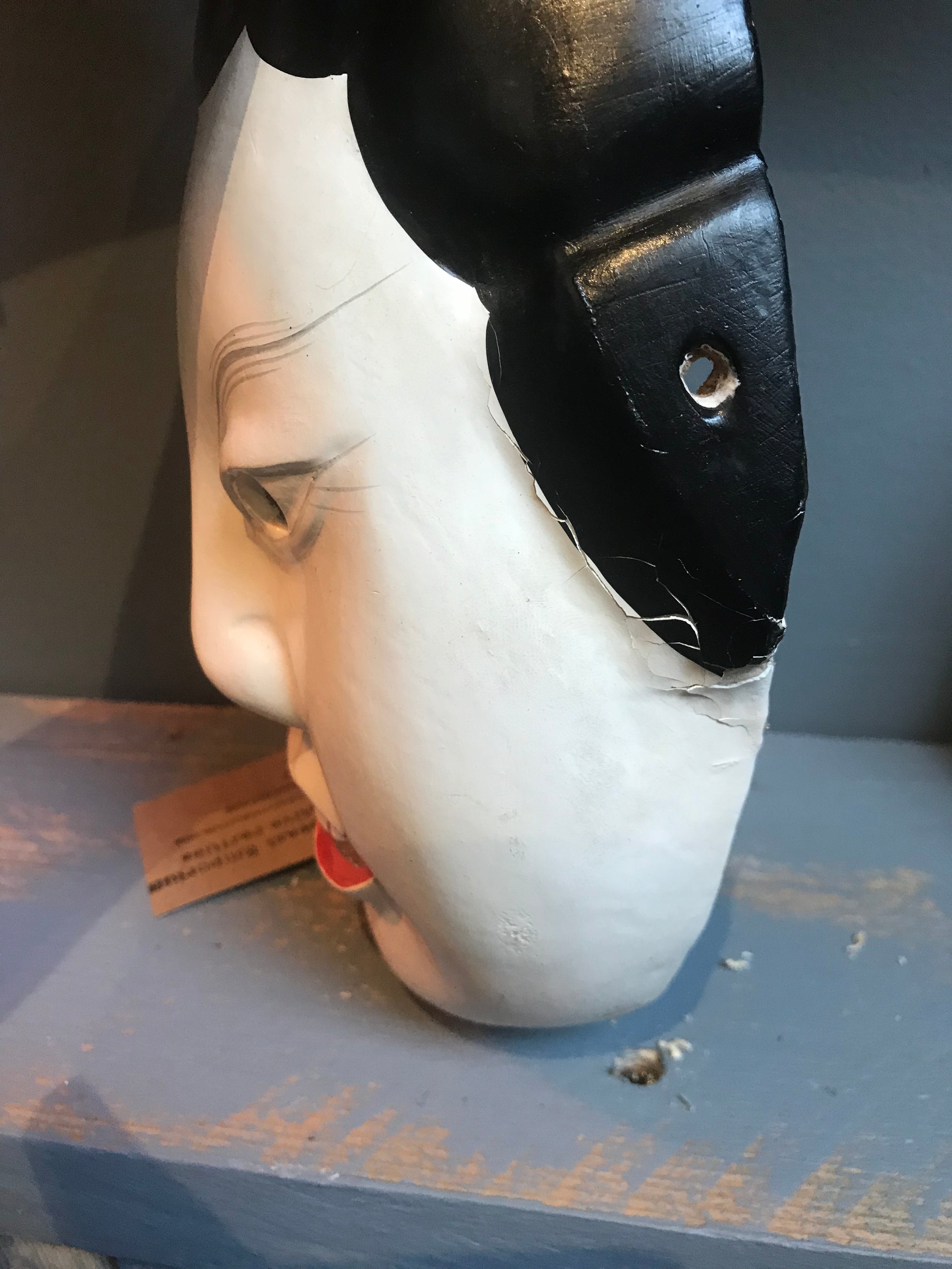 A carved wooden hand-painted Japanese noh mask