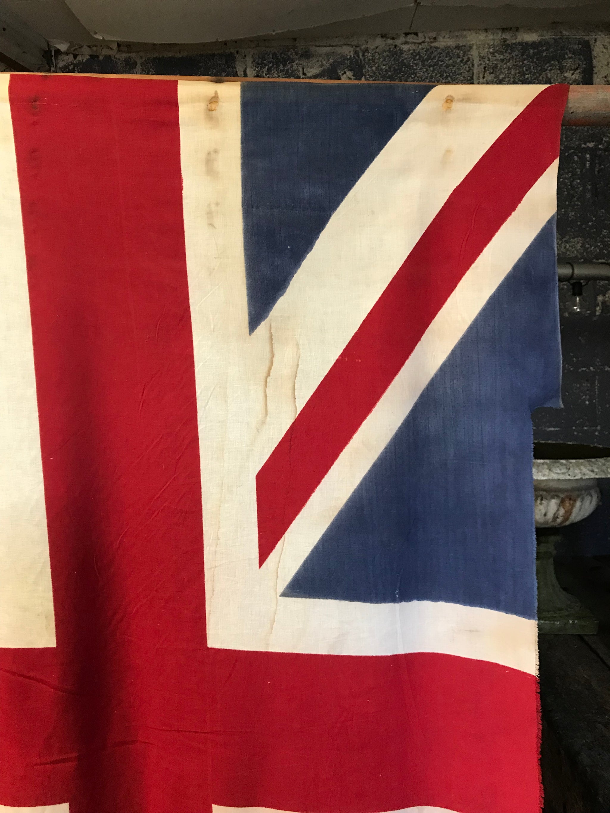 A very large Union Jack flag on a wooden pole