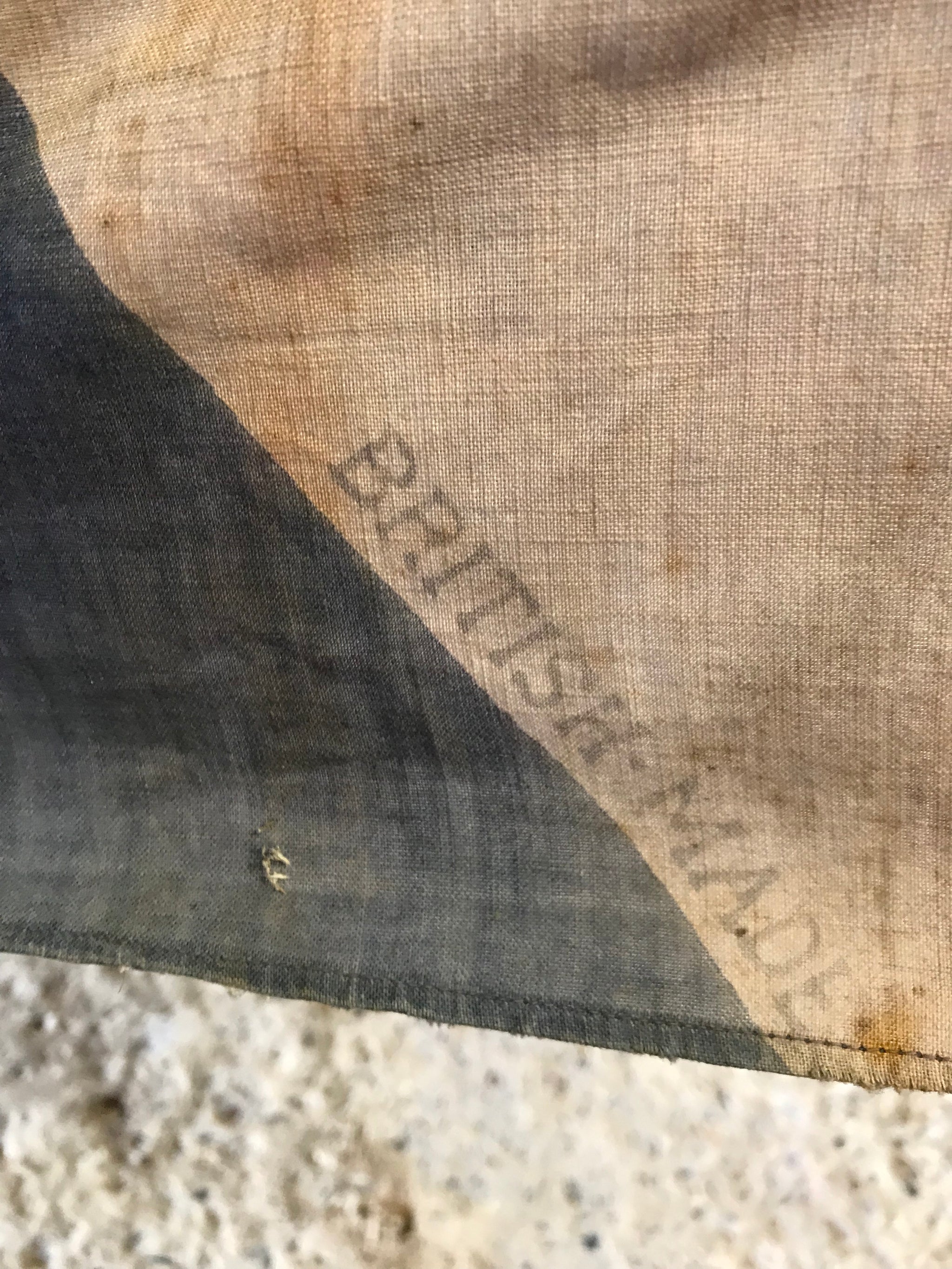 A very large Union Jack flag on a wooden pole