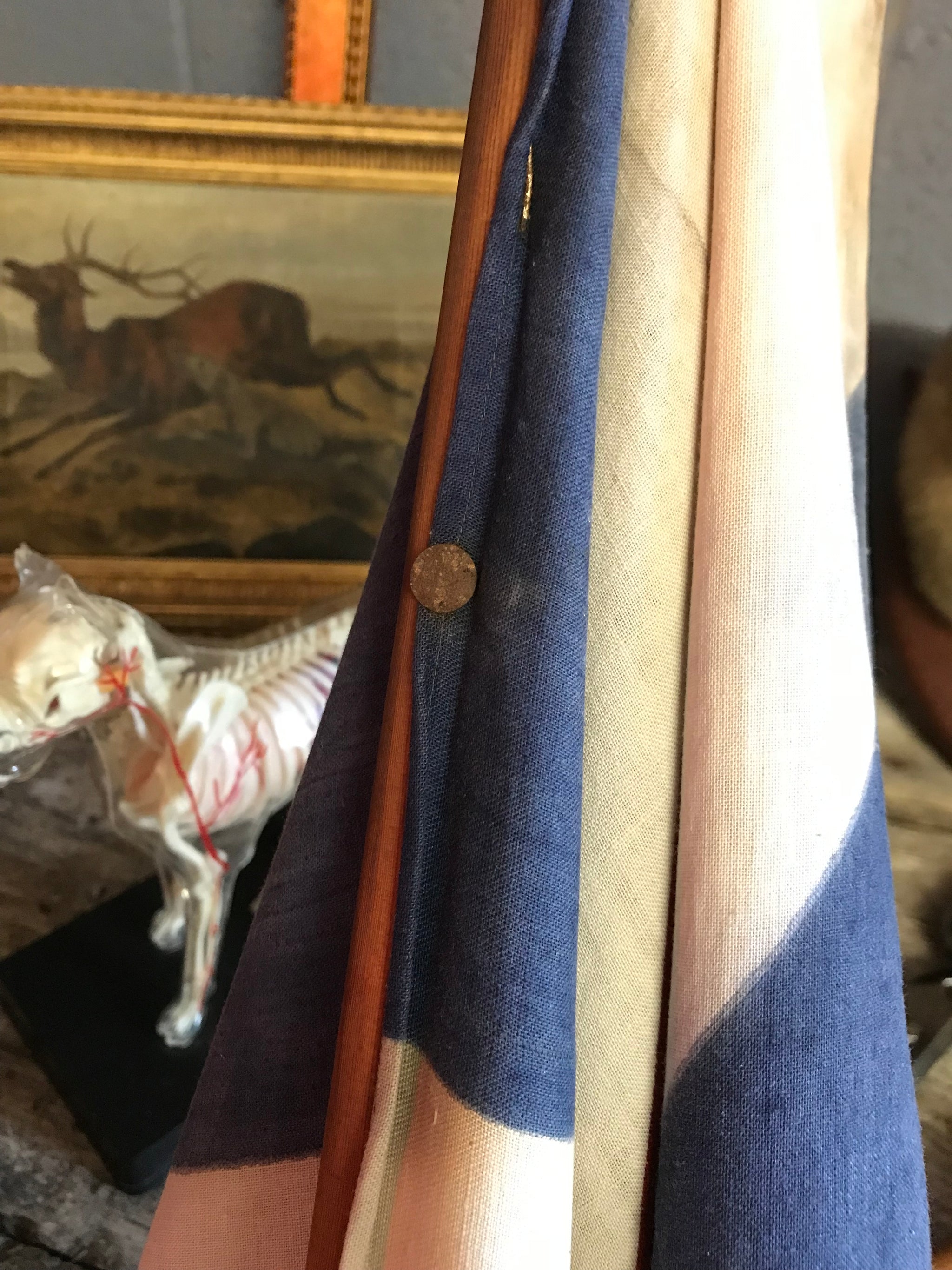 A very large Union Jack flag on a wooden pole