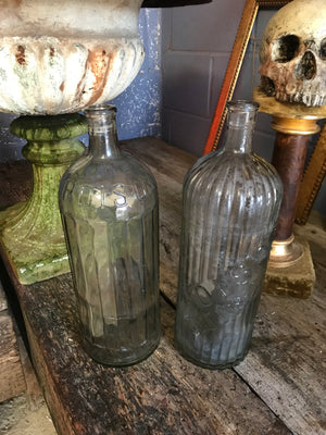 A large iridescent apothecary poison bottle
