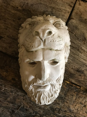 An old plaster head of Hercules wearing the Nemean lion skin