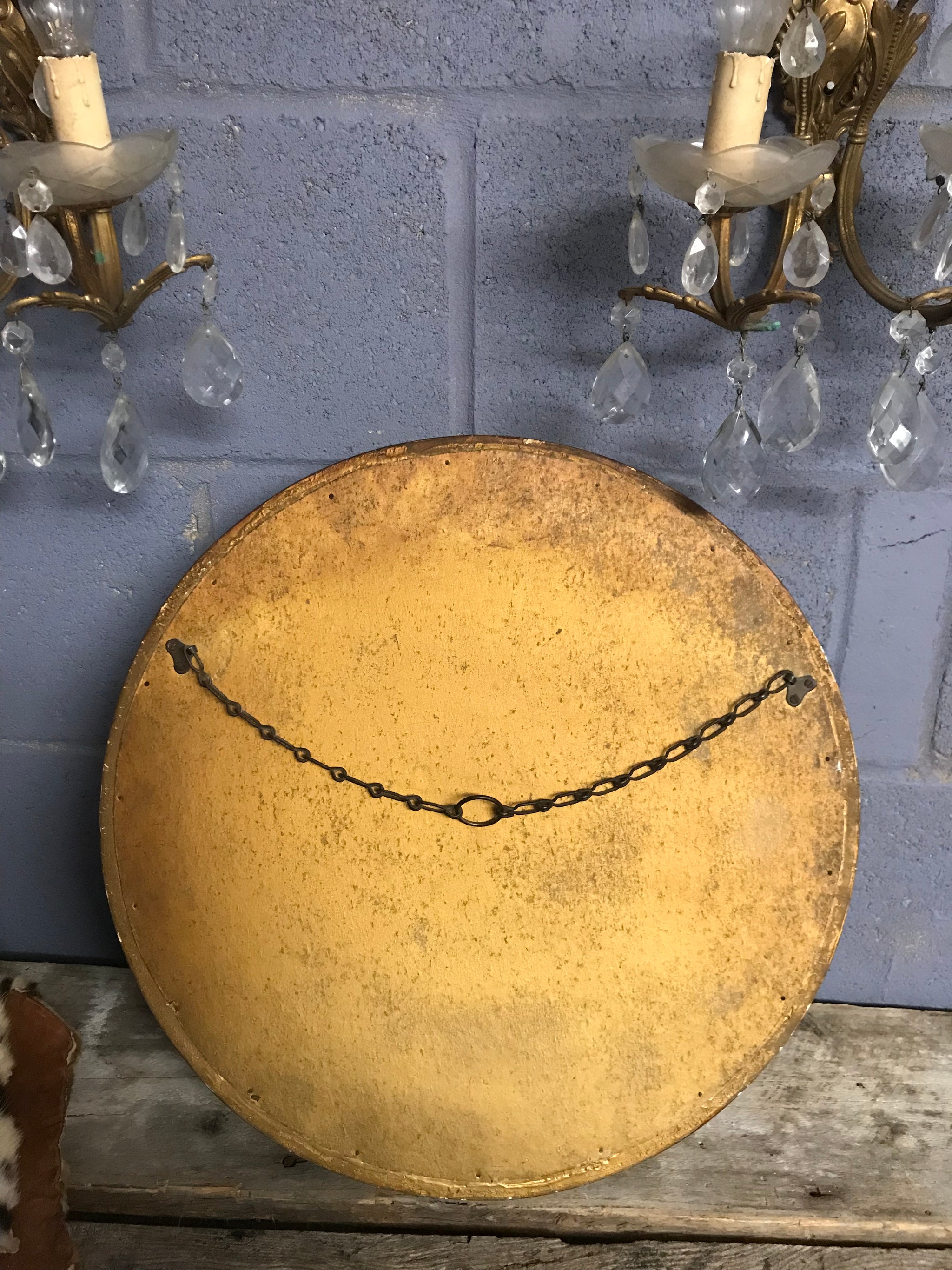 A large gilt convex ball mirror