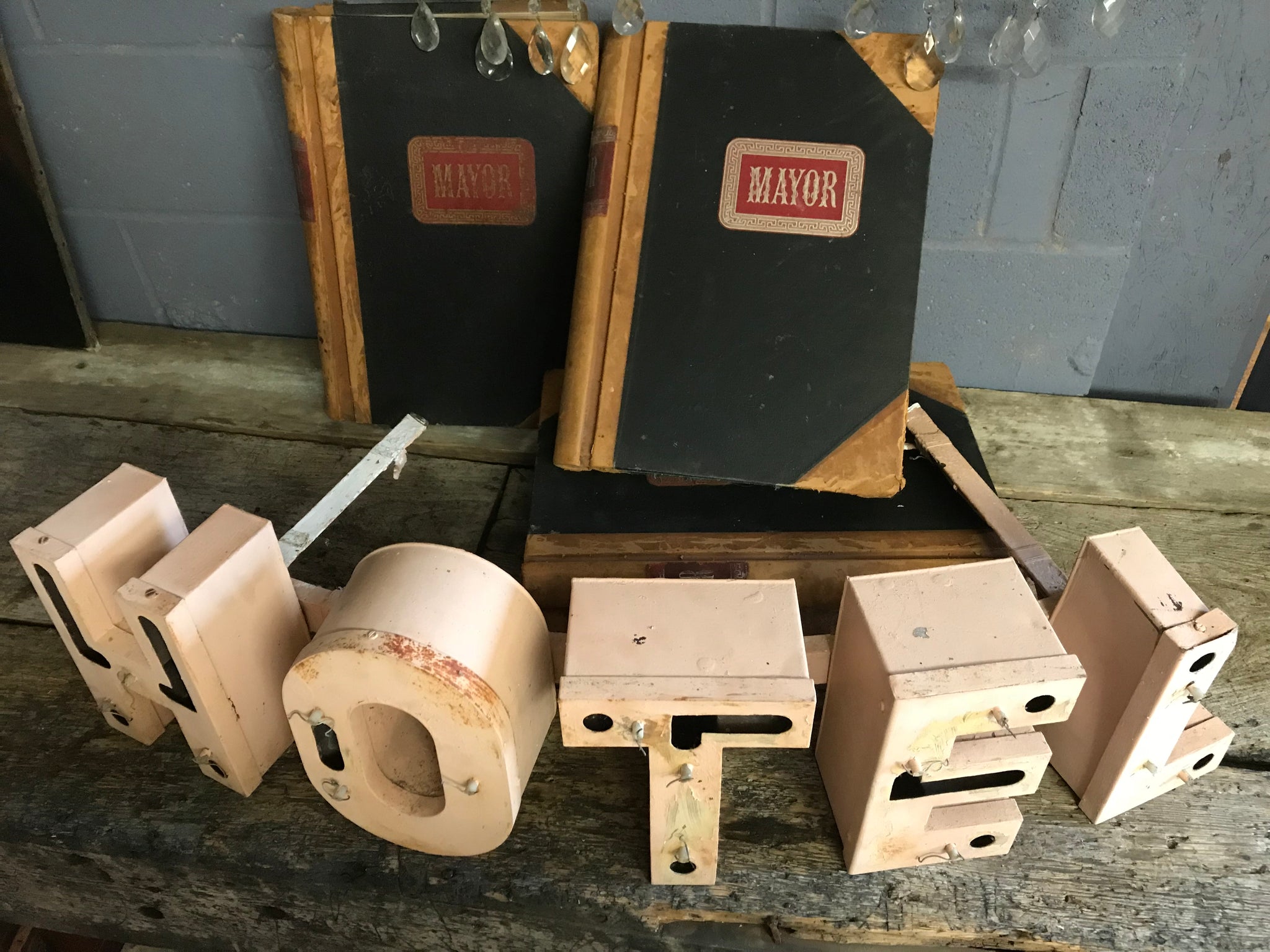 A salvaged pink metal illuminated HOTEL neon advertising sign