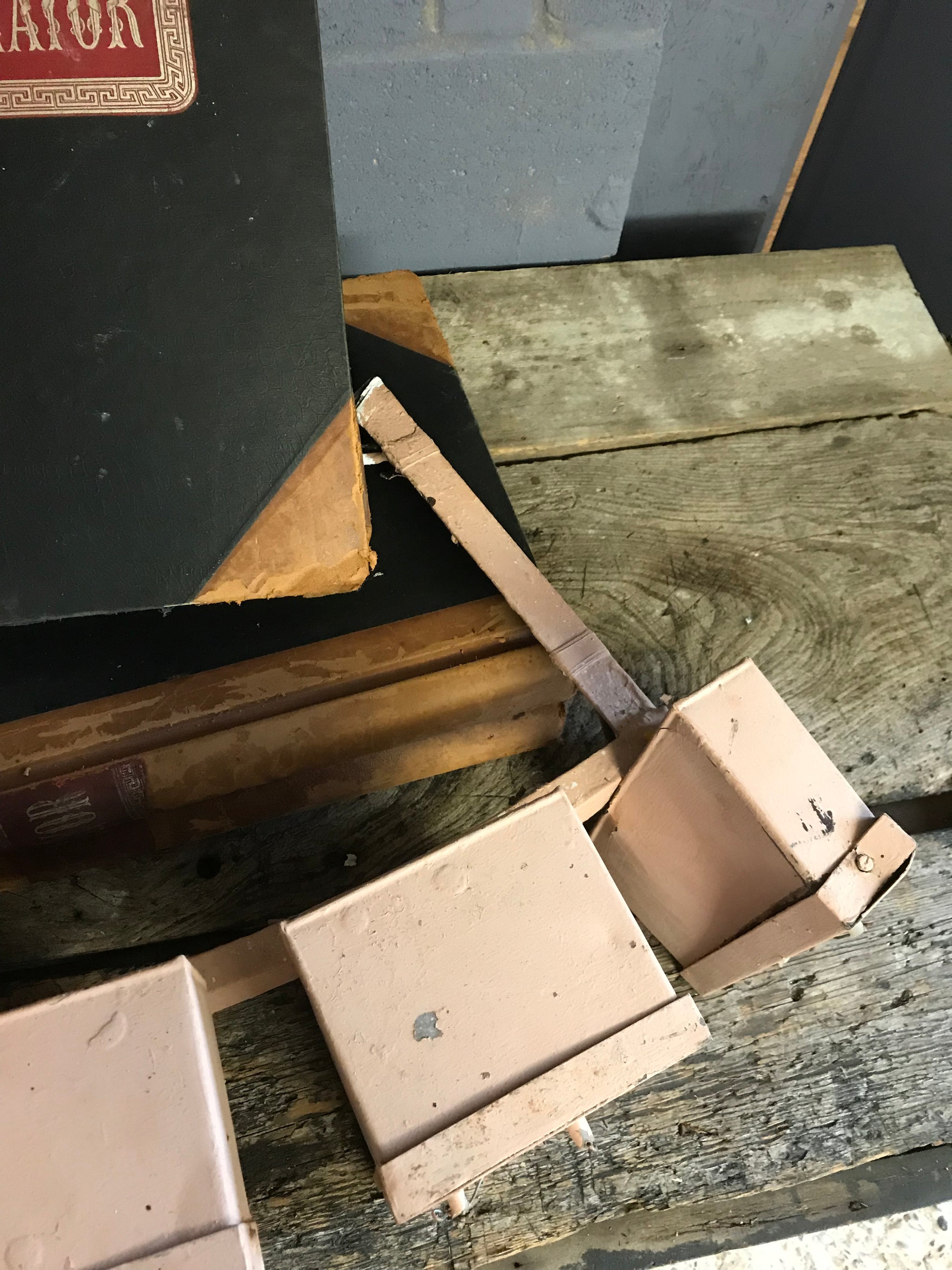 A salvaged pink metal illuminated HOTEL neon advertising sign