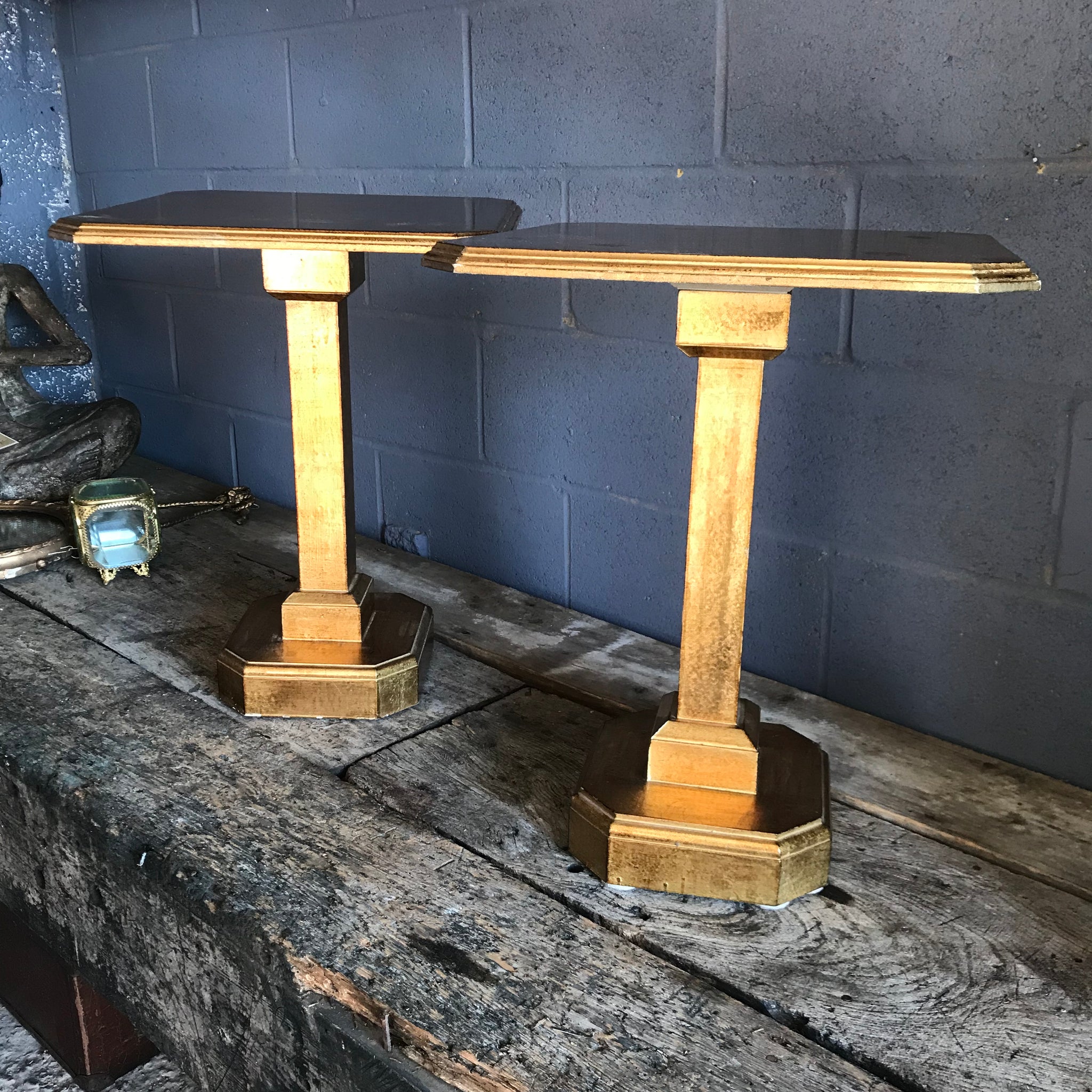 A pair of Art Deco Hollywood Regency gilt side tables