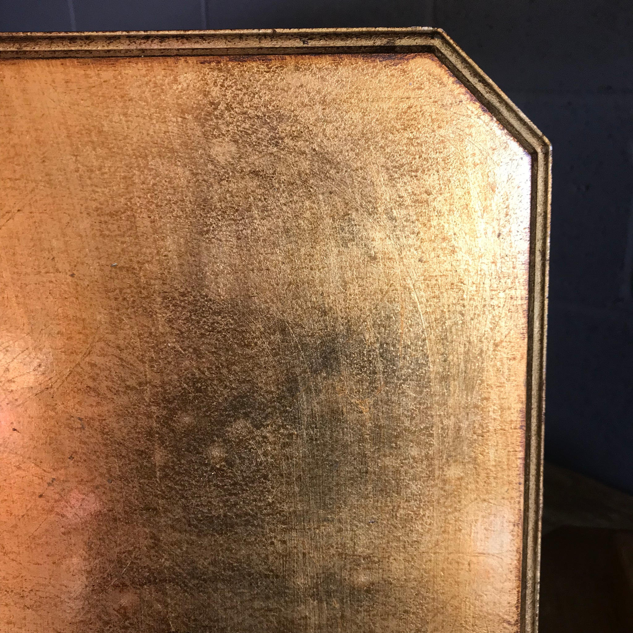 A pair of Art Deco Hollywood Regency gilt side tables