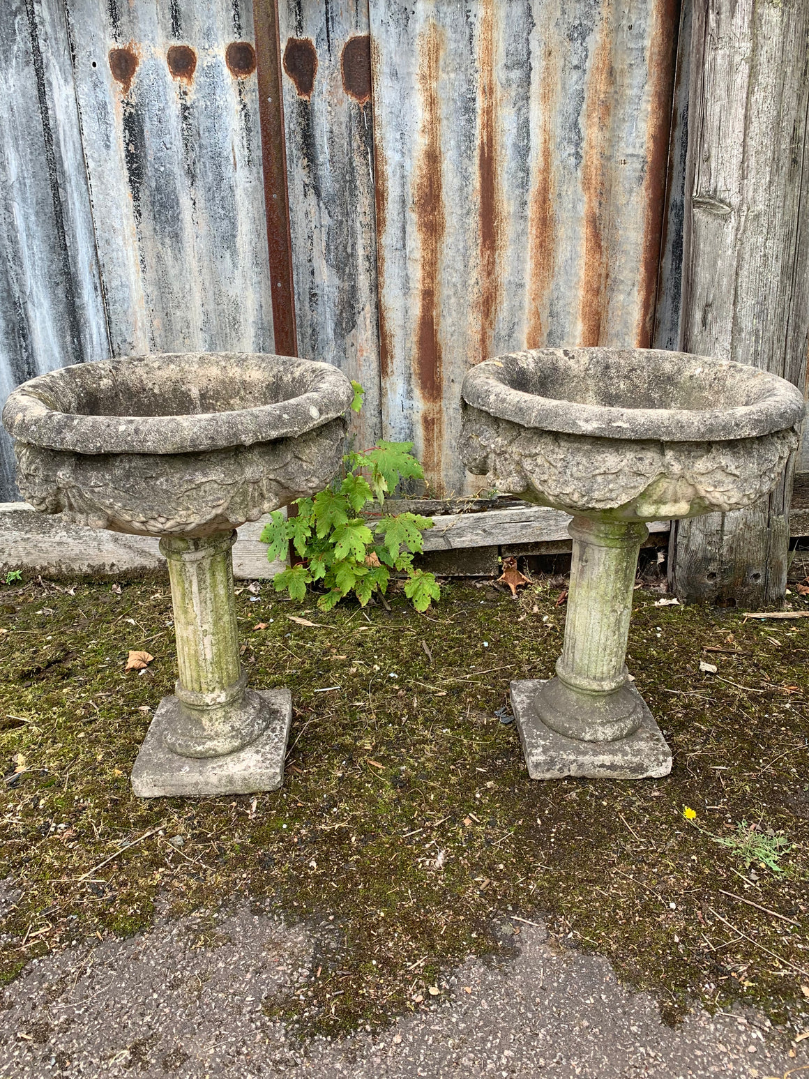 A pair of large stone classical urns