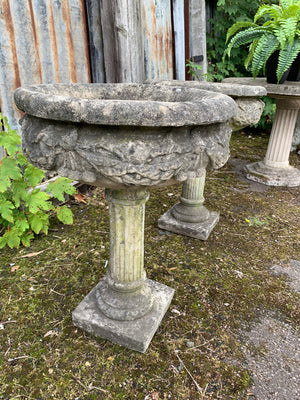 A pair of large stone classical urns