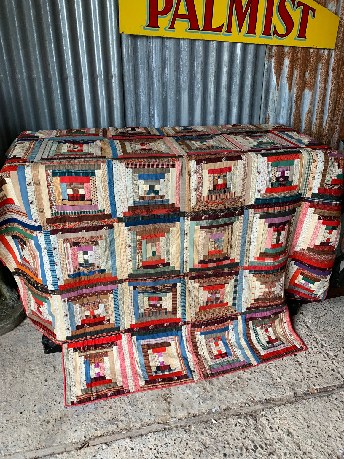 An American hand sewn patchwork log cabin quilt