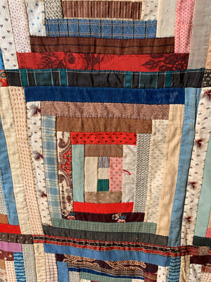 An American hand sewn patchwork log cabin quilt