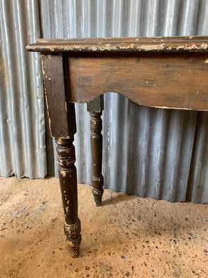 A vintage rustic occasional table
