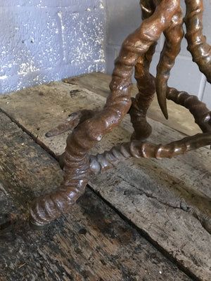 A unique brass side table with black buck antelope horn legs