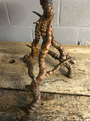 A unique brass side table with black buck antelope horn legs