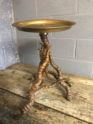 A unique brass side table with black buck antelope horn legs
