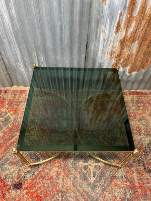 A brass and green glass Hollywood Regency coffee table