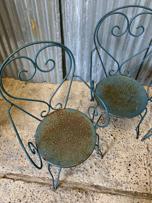 A set of four French blue wire work garden chairs