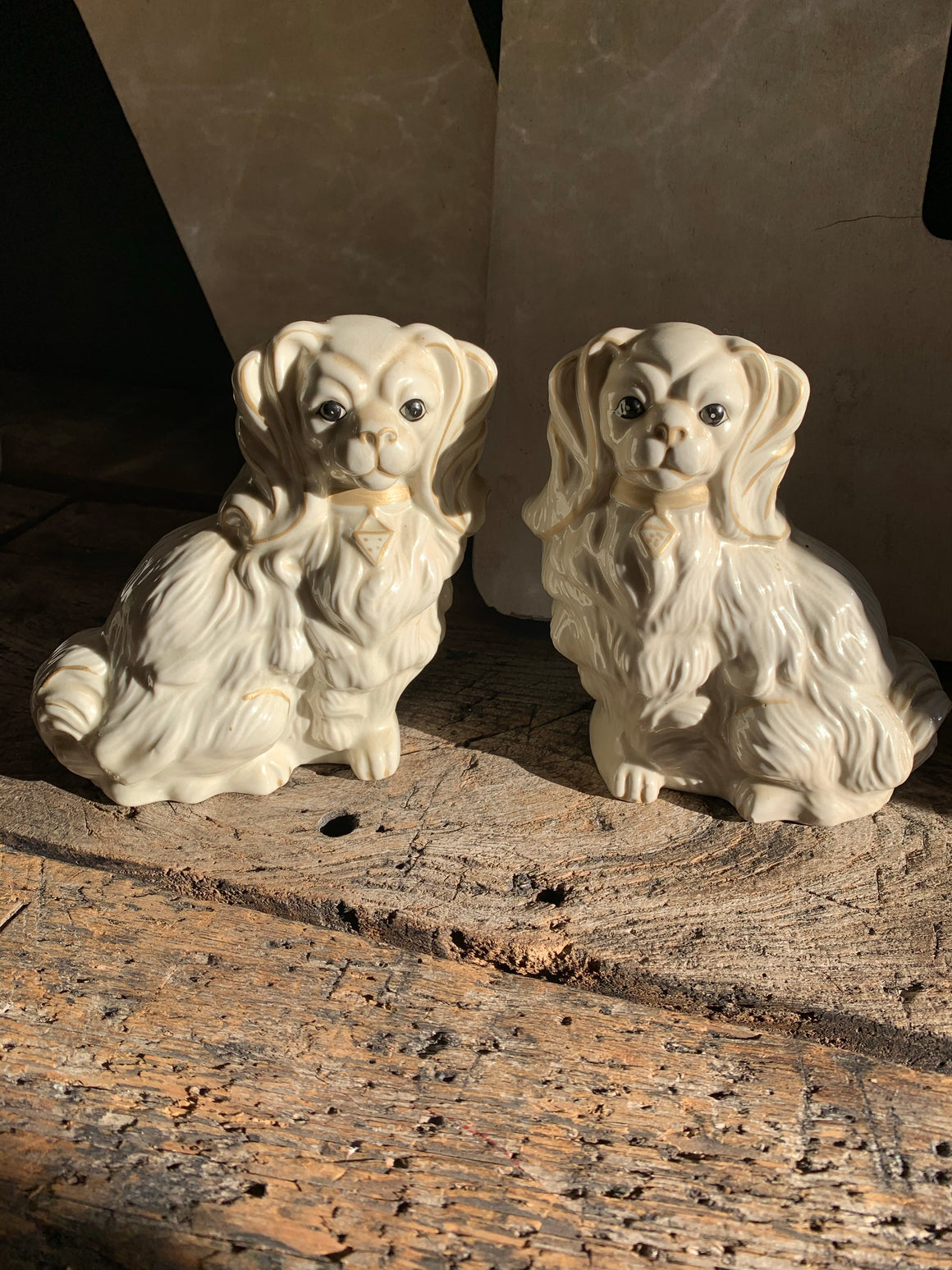 A pair of white ceramic Staffordshire style dogs