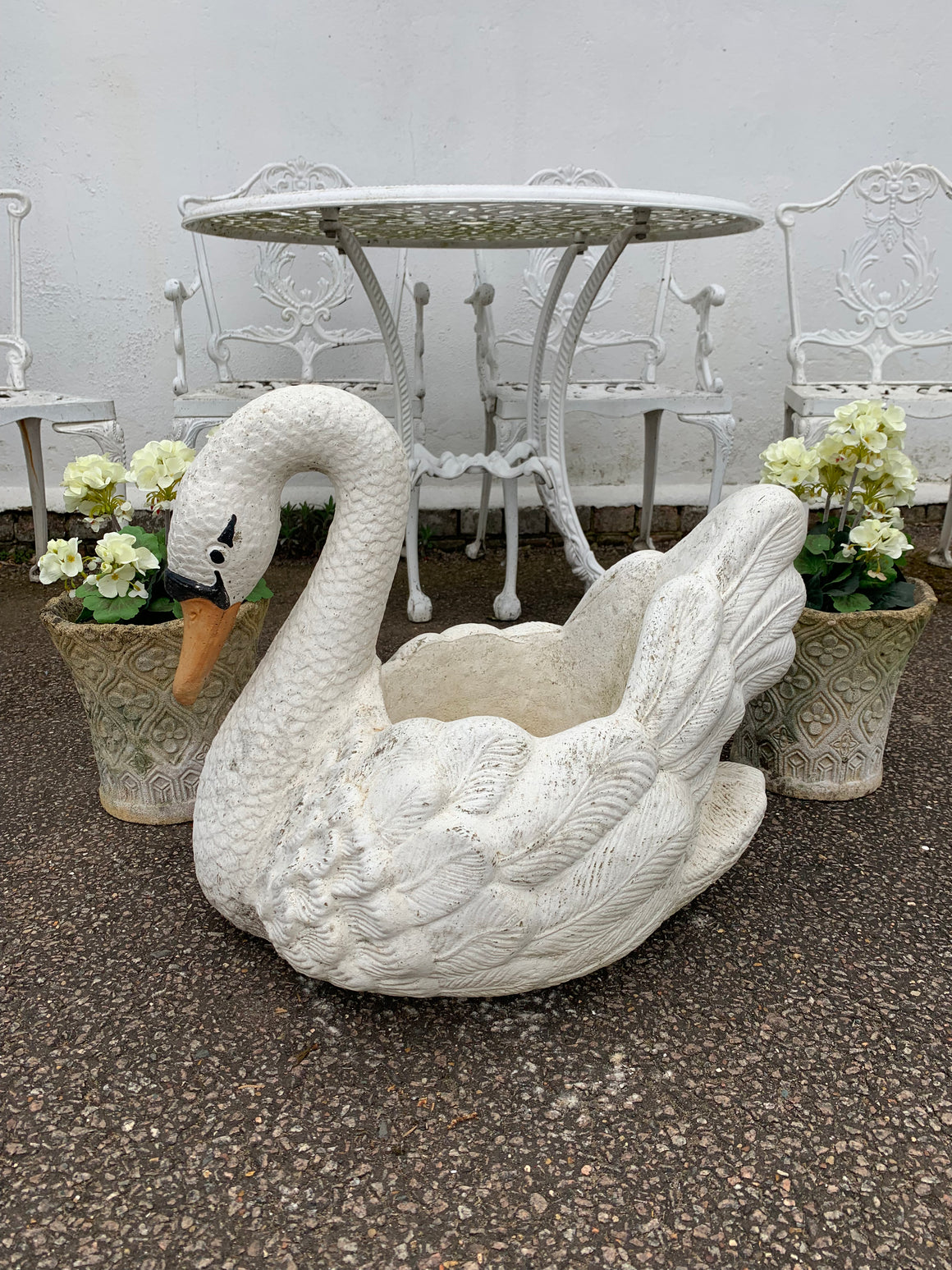 A very large cast stone swan planter